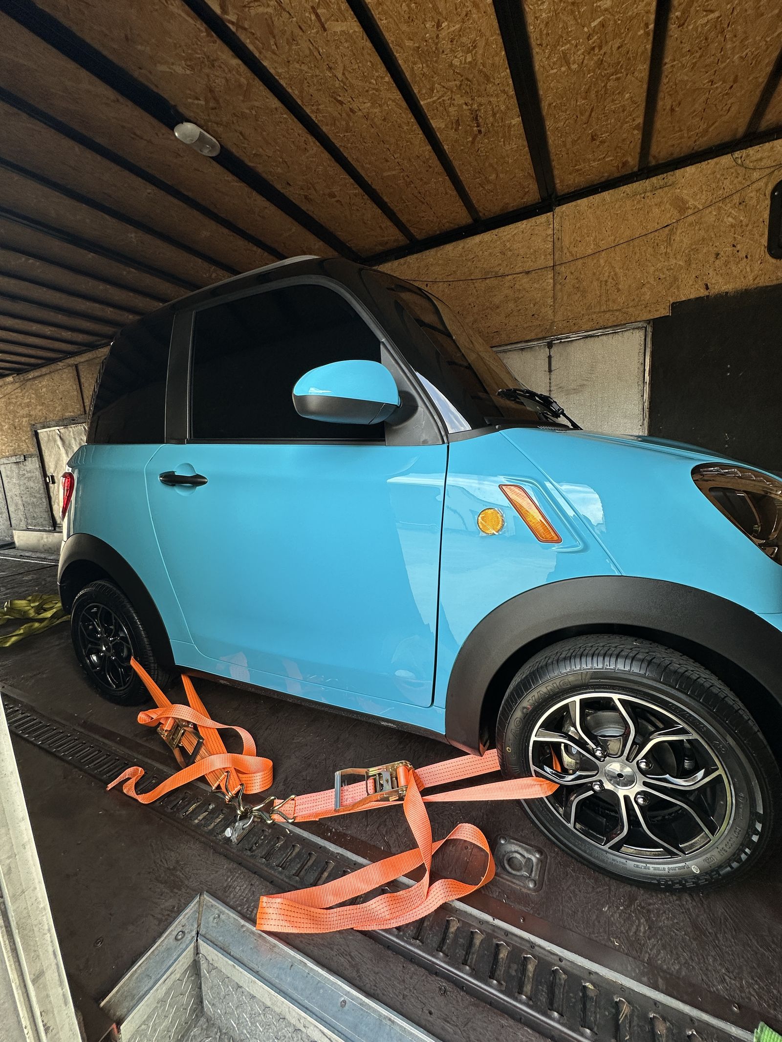 Close-up of an Aqua Blue REV M2 strapped down for transport
