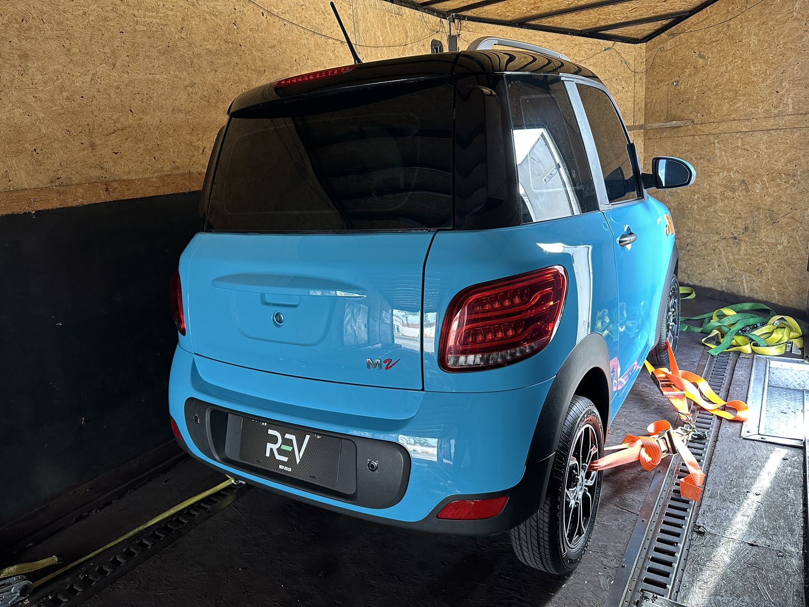 Aqua Blue REV M2 secured inside an enclosed trailer