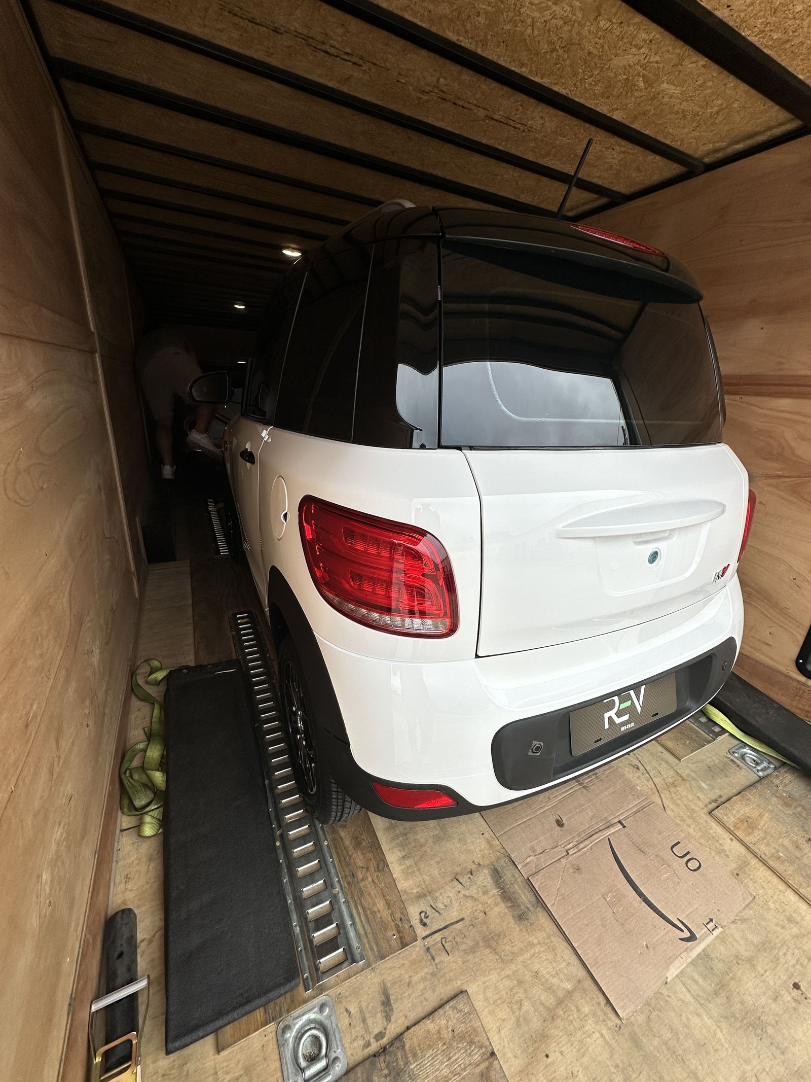 Two-tone REV M2 secured inside an enclosed trailer ready for delivery
